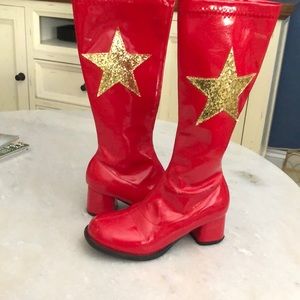 Girls red patent leather boots gold stars.